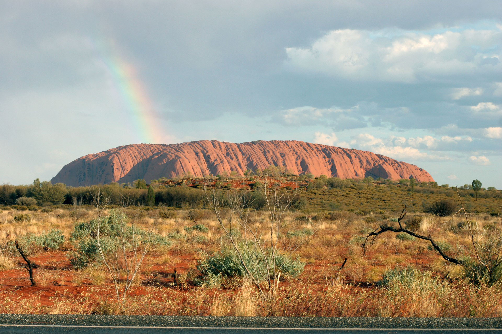 Uluru and a rainbow during the MULGA deployment recovery in 2016, after the Petermann Ranges earthquake. Credit: Hrvoje Tkalčić