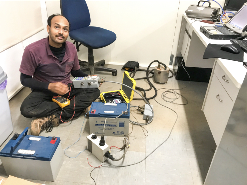 A man holding Seismic Testing equipments.