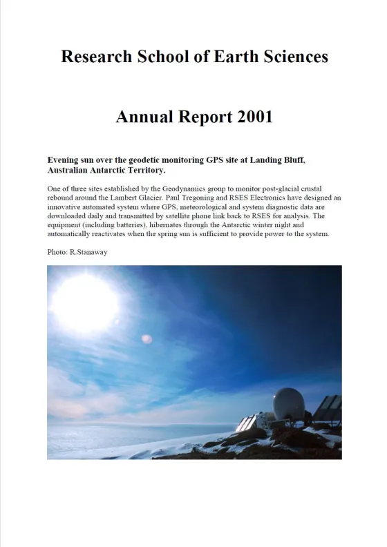 Photograph of a geodetic monitoring station at Landing Bluff in the Antarctic, with solar panels and scientific equipment against a backdrop of a sunlit icy landscape.