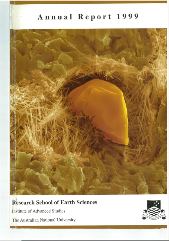Cover of the 1999 Annual Report for the Research School of Earth Sciences at The Australian National University, featuring a close-up image of an orange crystalline structure surrounded by fragmented particles.